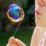 kid blowing bubble 